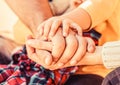 Hands of father, mother, keep hand little baby. Parents hold the baby hands. Closeup of baby hand into parents hands