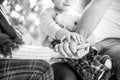 Hands of father, mother, keep hand little baby. Parents hold the baby hands. Closeup of baby hand into parents hands Royalty Free Stock Photo