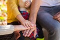 Hands of father, mother, keep hand little baby. Parents hold the baby hands. Closeup of baby hand into parents hands