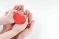 Hands of father and son holding red heart, heart health insurance, family day, world heart day Royalty Free Stock Photo