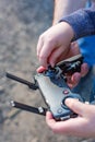 Hands of Father and son holding remote control joystick and piloting quadrocopter Royalty Free Stock Photo