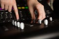 Hands of female audio engineer using sound mixer Royalty Free Stock Photo
