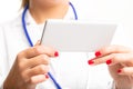 Hands of a female doctor using a mobile phone Royalty Free Stock Photo