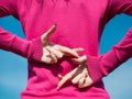 Hands of female person in pink blouse