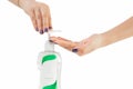 Hands female using wash hand sanitizer gel pump dispenser blurry green nature background Royalty Free Stock Photo