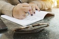 Hands of a Female Write Down Her Life Goals in a Journal Royalty Free Stock Photo