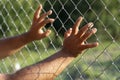 Hands on the fence Royalty Free Stock Photo