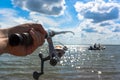 Hands fisherman keep spinning rod Royalty Free Stock Photo