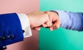 Hands fists of business people touch in gesture. Teamwork or good job symbol. Type of handshake or hand gesture with