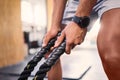Hands, fitness and battle rope with a sports man training for cardio or endurance in a gym workout. Grip, heavy ropes Royalty Free Stock Photo