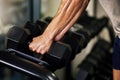 Hands, fitness and man doing weight training in a gym for strength, wellness and health as a workout routine. Sport Royalty Free Stock Photo