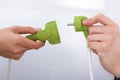 Hands Fixing Green Plugs Royalty Free Stock Photo