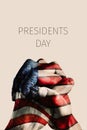 Hands with flag of US and text presidents day