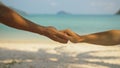 Hands of flirting young man and woman touching on sea beach Royalty Free Stock Photo