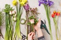 Hands of florist making bouquet spring flowers Royalty Free Stock Photo