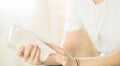 Hands folded in prayer on a Holy Bible in church concept for faith, spirituality and religion, woman reading holy bible in the Royalty Free Stock Photo