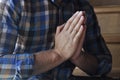 Hands folded in prayer. A petition for clemency. Prayer for the whole world. A man is praying. For America and Europe. World map Royalty Free Stock Photo