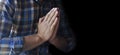 Hands folded in prayer. A petition for clemency. Prayer for the whole world. A man is praying. For America and Europe. World map Royalty Free Stock Photo