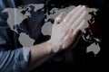 Hands folded in prayer for the whole world. A request for grace. Prayer to God. Christian Royalty Free Stock Photo