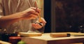 Hands, food and chef cooking sushi in restaurant for traditional Japanese cuisine or dish closeup. Kitchen, table for