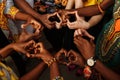 Hands in the form of heart of happy group of multinational African, latin american and european people which stay Royalty Free Stock Photo