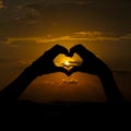 The hands that form love with the sunset Royalty Free Stock Photo