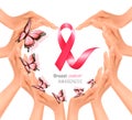 Hands forming a heart shape with a pink breast cancer awareness