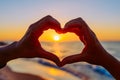 Hands forming a heart shape with sunset Royalty Free Stock Photo