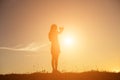 Hands forming a heart shape with sunset silhouette Royalty Free Stock Photo