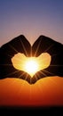 Hands Forming Heart Shape at Sunset Royalty Free Stock Photo