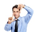 Hands, frame and portrait of business man on studio background for profile picture. Face, worker and finger framing for