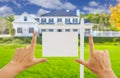 Hands Framing Blank Real Estate Sign and New House