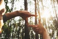 hands framing distant over view sun