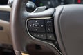 Hands free and media control buttons on the steering wheel in modern car interior. Buttons on the steering wheel to Royalty Free Stock Photo