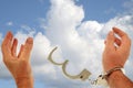 Hands freeing handcuffs Royalty Free Stock Photo