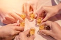 Hands of friends with glass Cheers clinking whisky drink in party