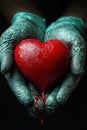 Hands gently hold a vibrant red heart with a dripping effect, showcasing a profound expression of love and emotion Royalty Free Stock Photo