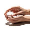 Hands gently holding a clear crystal ball on a white background Royalty Free Stock Photo