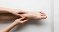 Hands gently massaging a foot, positioned Royalty Free Stock Photo