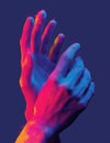 Hands gesture in neon light. Abstarct artistic composition. Bright vivid bold colors. Surrealistic collage artwork. Isolated dark