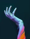 Hands gesture in neon light. Abstarct artistic composition. Bright vivid bold colors. Surrealistic collage artwork. Isolated dark