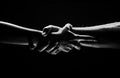 Hands gesturing on black background. Giving a helping hand. Support and help, salvation. Strength strong hads of two Royalty Free Stock Photo