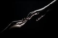 Hands gesturing on black background. Giving a helping hand. Support and help, salvation. Hands of two people at the time Royalty Free Stock Photo