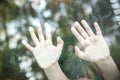 Hands of the girl behind the glass Royalty Free Stock Photo