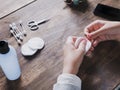 Hands of a girl cleaning her fingernails with varnish remover Royalty Free Stock Photo