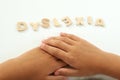 Hands of a girl form the word dyslexia