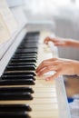 Hands of a girl playing the piano Royalty Free Stock Photo