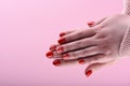 Hands of a girl with a red manicure on her nails Royalty Free Stock Photo