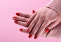 Hands of a girl with a red manicure on her nails Royalty Free Stock Photo