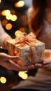 Hands of girls clasp time gifts, enclosing a meaningful present box. Memory keepers. Royalty Free Stock Photo